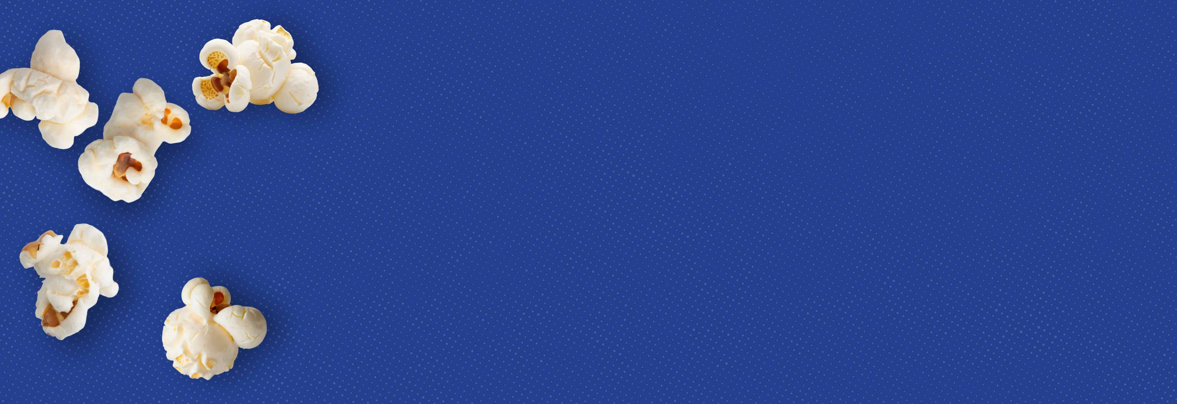 Weaver Popcron: Work & life in balance. Blue background with half-tone effect and popped popcorn kernels.