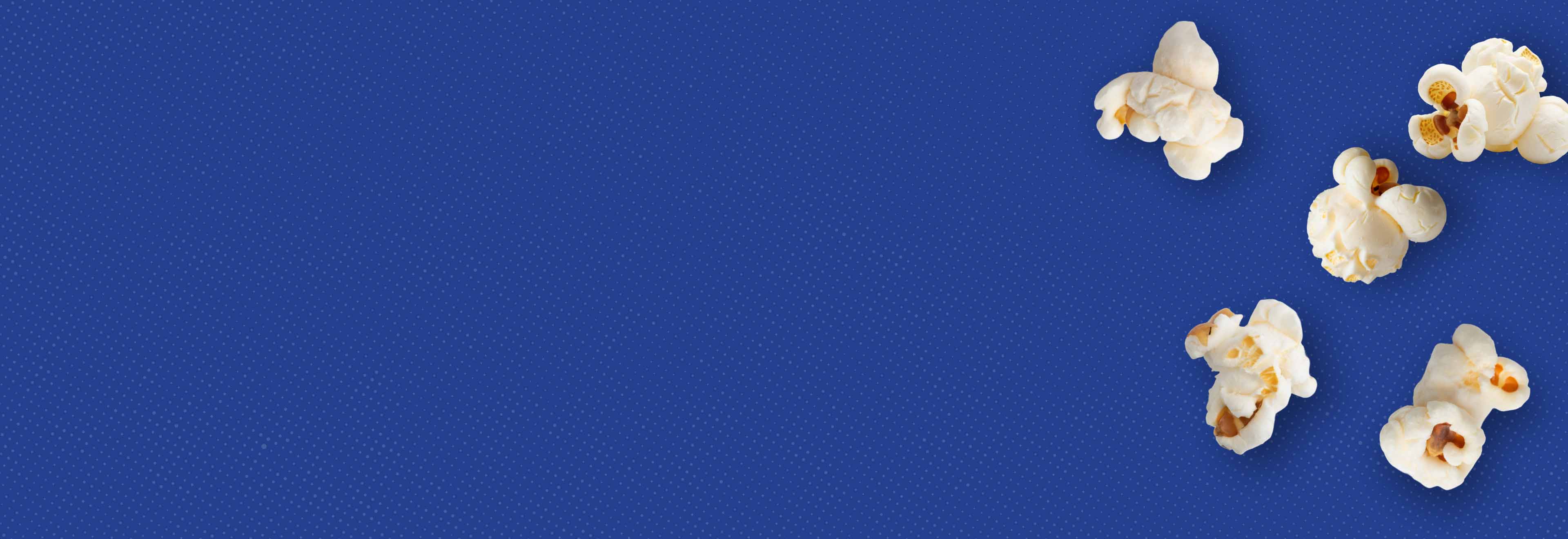 Weaver Popcorn: Positively Great. Blue background with half-tone effect and popped popcorn kernels.