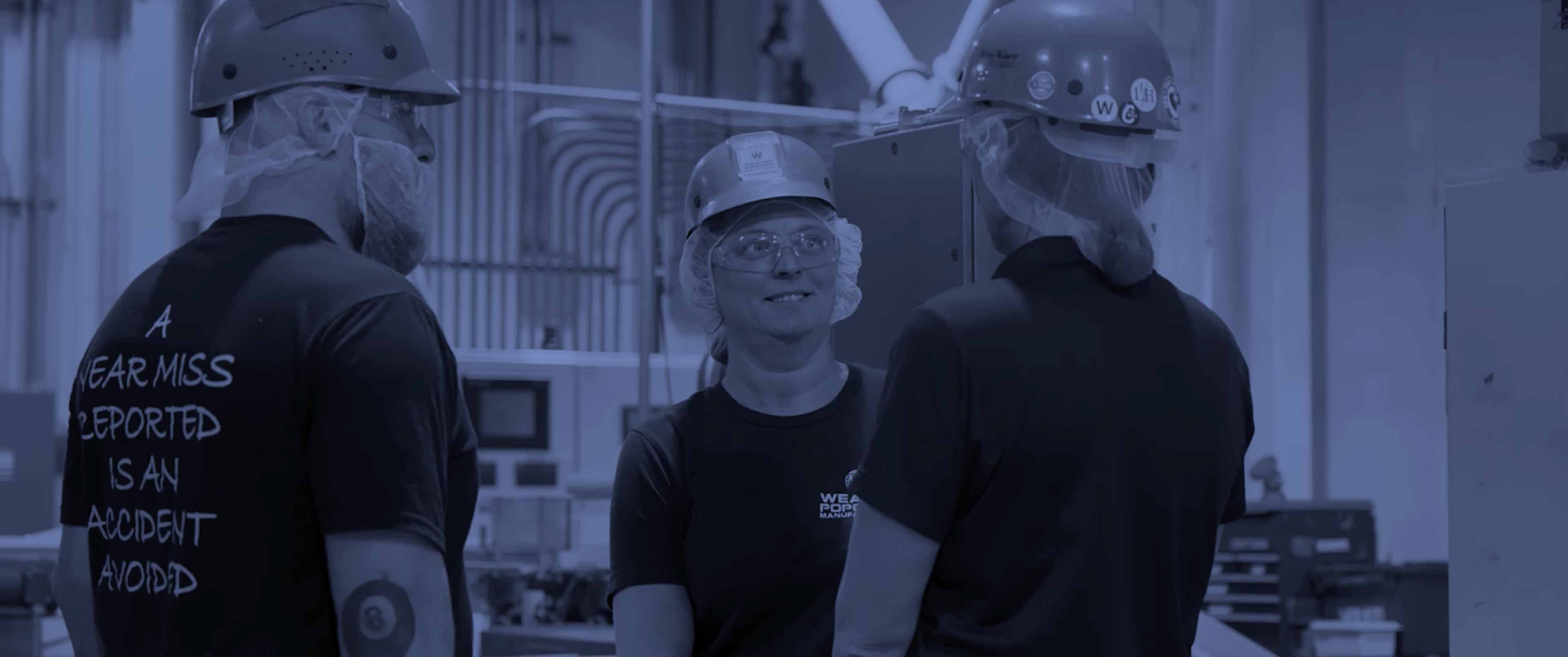 Weaver Popcorn A small wooden bowl of popcorn on a table.